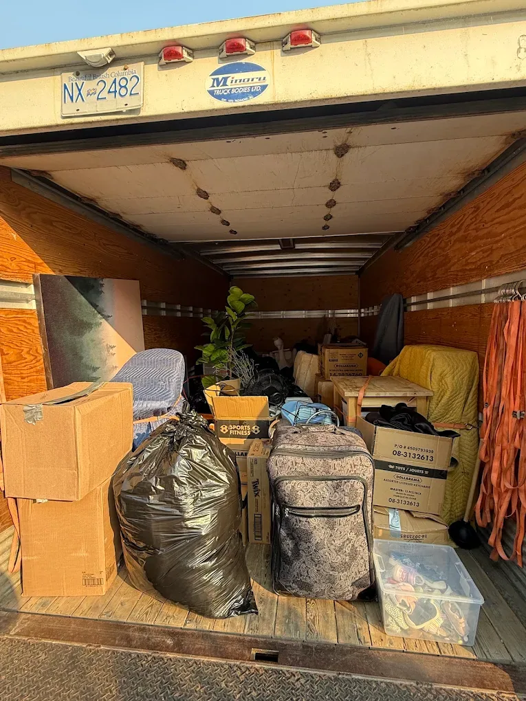 Household items and furniture loaded for transport.
