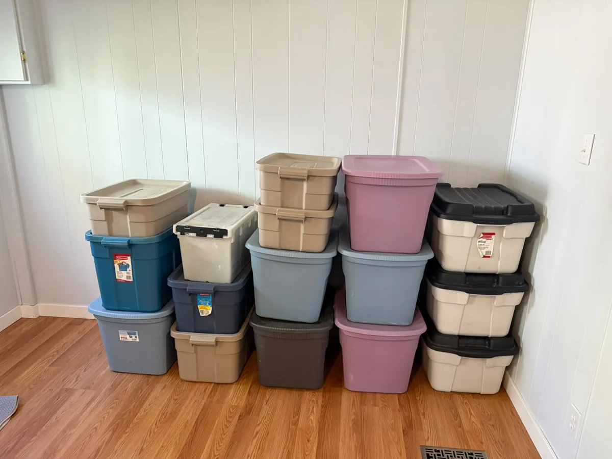 Storage bins stacked inside a room