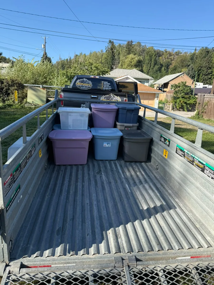 Storage bins loaded in the trailer behind the Singh truck