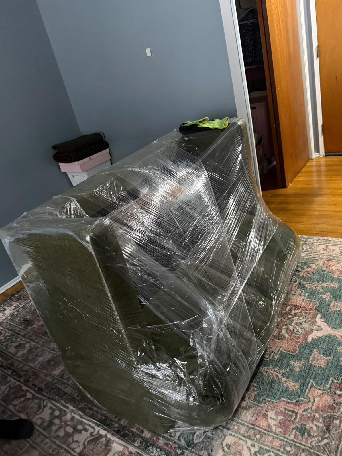 Wrapped upholstered seating prepared for a household move.