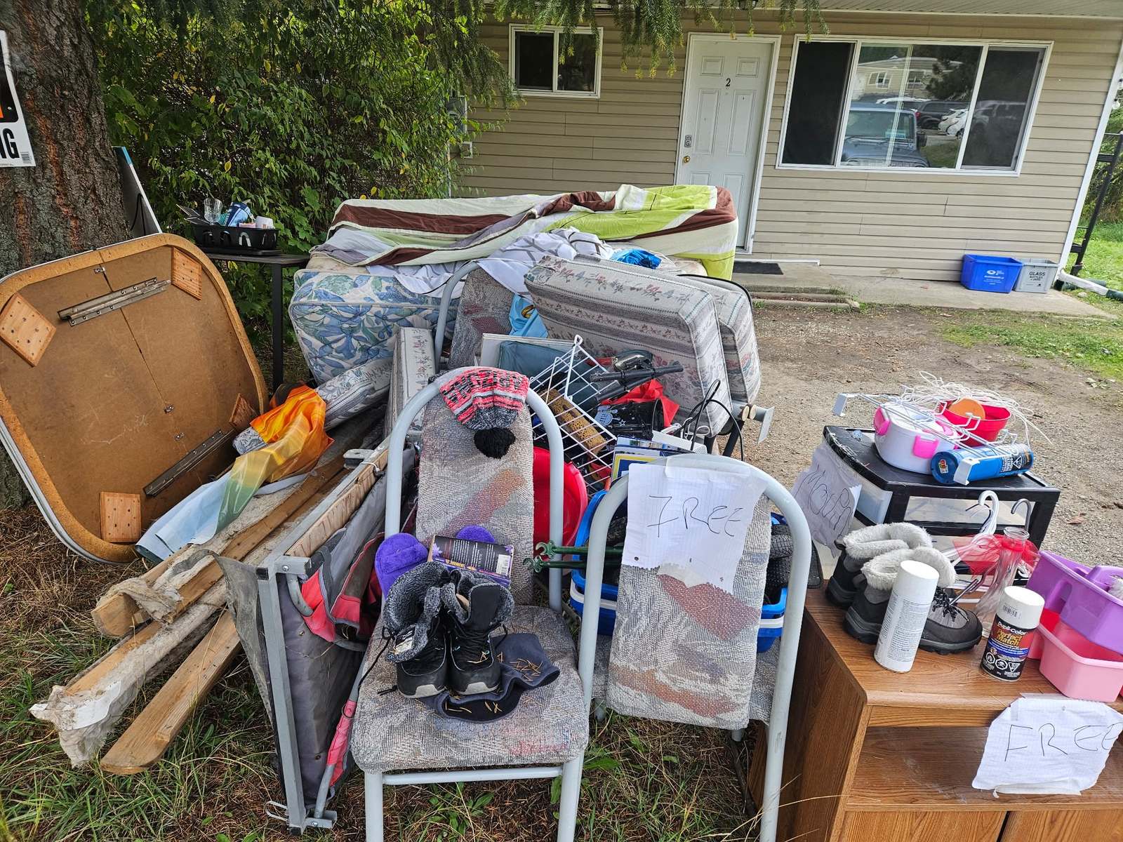 Bulky furniture and household items staged outdoors before same-day junk removal in Robson near Castlegar.